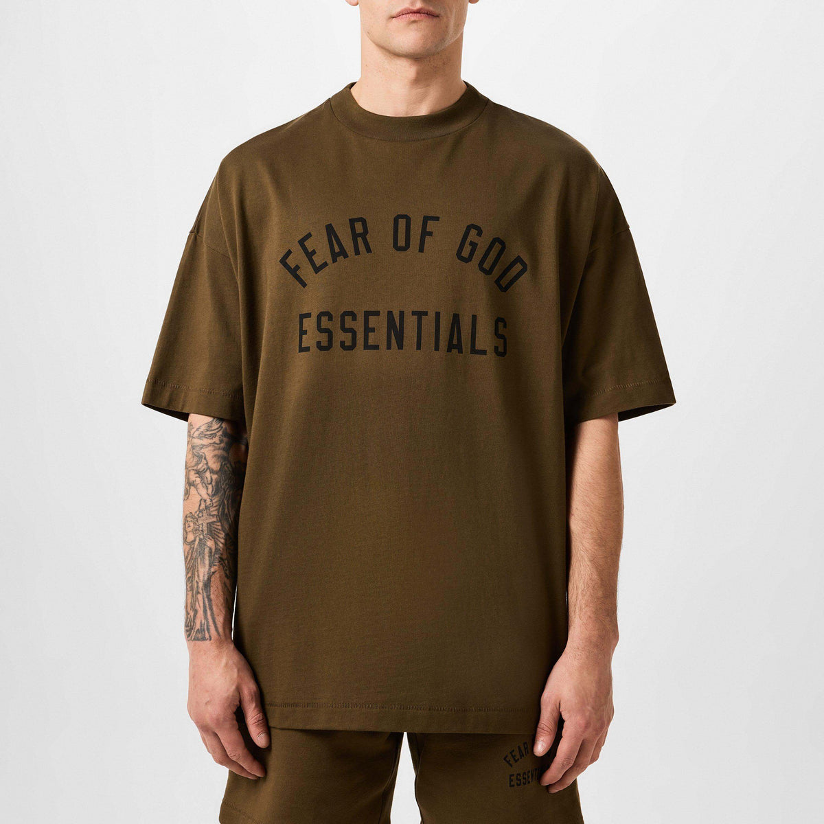 Fear of God Essentials Collection Heavy Crewneck Tee in Brown, showcasing relaxed luxury style with distinct logo design.